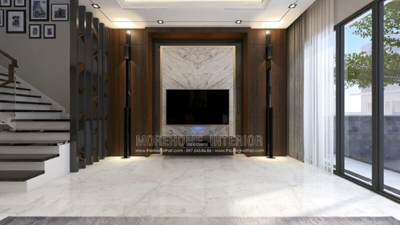 Trang trí phòng khách với đá trắng đối vân ốp tường đen cùng trang trí đối sánh giữa hai dàn loa dọc theo đường chiếu sáng từ mảng tường gỗ đẹp mắt. Thiết kế nội thất biệt thự